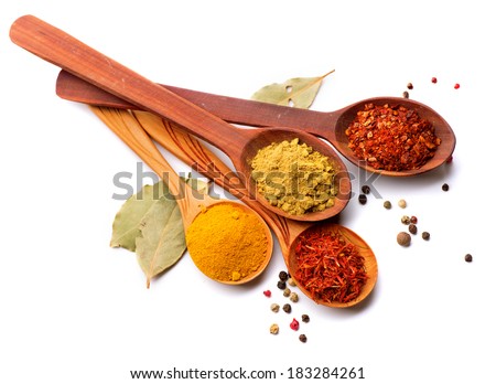 Spices. Spice in Wooden spoon. Herbs. Curry, Saffron, turmeric, cinnamon and other isolated on a white background Royalty-Free Stock Photo #183284261