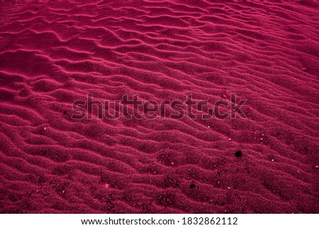 Dark crimson desert background and texture