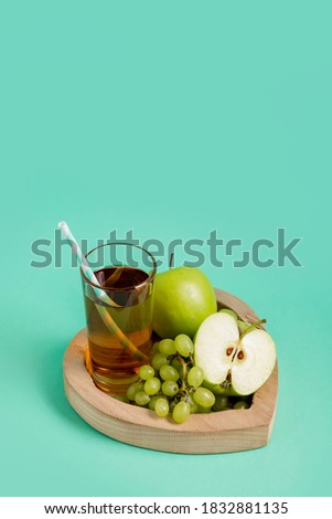 Fruit juice, blocks, grapes. Mint color. Conceptual photography. Copy space