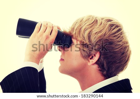 Business Vision concept - young man with binoculars
