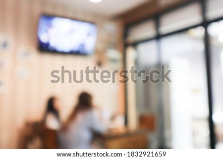 blurred image of people of enjoy in restaurant.