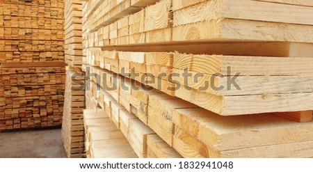 Raw wood drying in the lumber warehouse Royalty-Free Stock Photo #1832941048