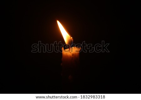 Lighting Candle in the dark background