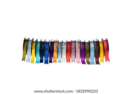 Colorful ribbons. Rolls of multicolored ribbons isolated white background. Accessories for packing and decorating gifts.