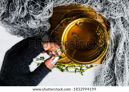 hand holding glass cup on white background 