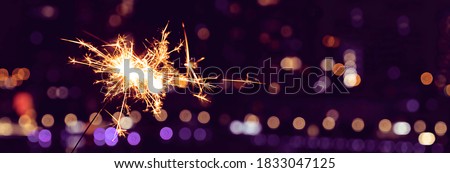 New Year's celebration sparkler at night Royalty-Free Stock Photo #1833047125