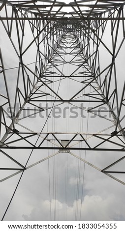 High voltage pylon on skies background, Transmission line tower, bottom View,location : Bandung, Indonesia.
