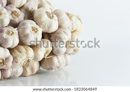 White garlic texture. Fresh garlic closeup. Spicy cooking ingredient picture. White garlic head heap. top view.