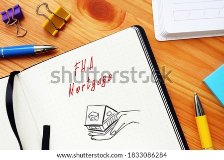 Business concept meaning FHA Mortgage with sign on the piece of paper.
