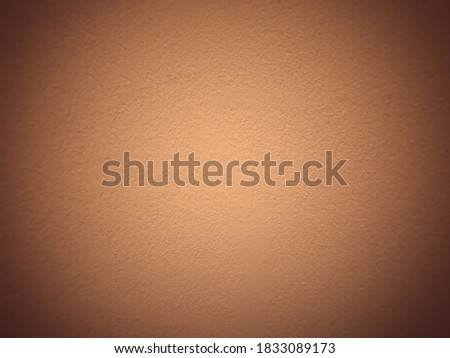 Abstract blurred brown cement wall using us a background or wallpapaer.