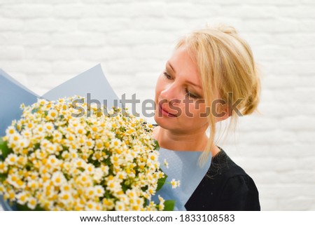 Woman with fresh flowers. womens day 8 march. Flower bouquet in hands of woman.