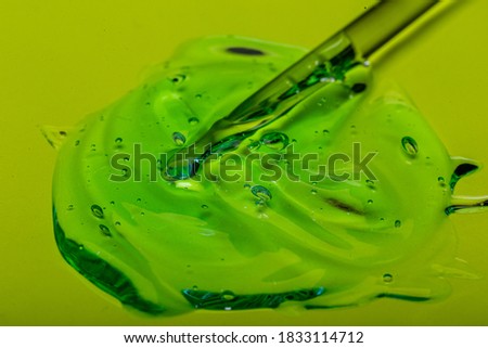 Squeezed cosmetic clear cream gel texture Iisolated on white background. Close up transparent Ectoplasm serum drop