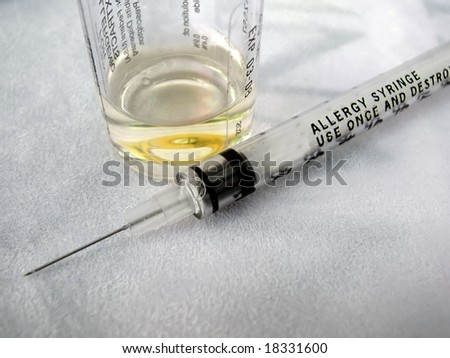 allergy syringe and vial of sterile diluent