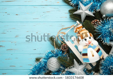 Christmas background with decorations on blue background. Top view.