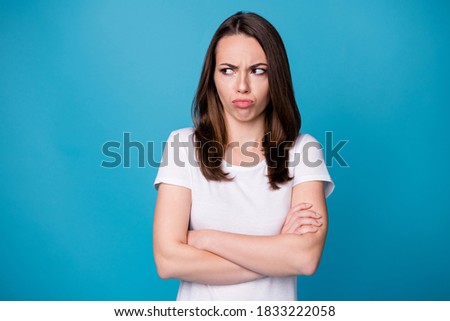 How could he. Photo of attractive lady hold arms hands crossed worker person bad mood boss fired her laid off look side offended wear casual white t-shirt isolated blue color background Royalty-Free Stock Photo #1833222058