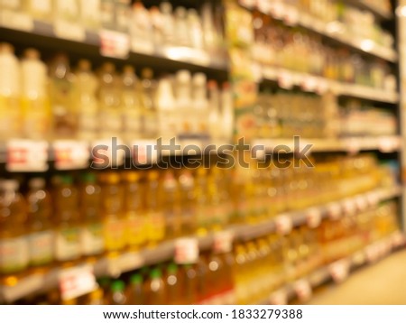 Various of Cooking oil was sale on shelves in supermarket. Blur photography for Background.