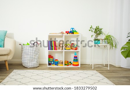 Organized space with children's toys and books Royalty-Free Stock Photo #1833279502