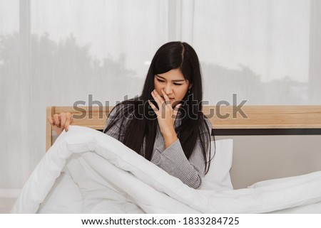 Concept health care : Woman had a runny nose, stuffy nose, cough, sneezing, sore throat due to dust allergies from dirty blankets, dust mite allergy symptoms.
 Royalty-Free Stock Photo #1833284725