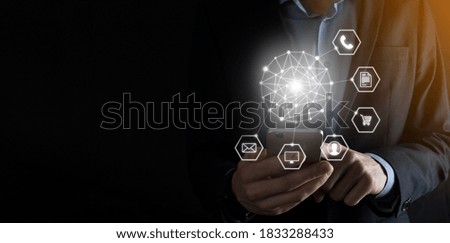 Business concept Close up of man using mobile smart phone and infographic icon of community technology digital.Concept of hi tech and big data. Toned image