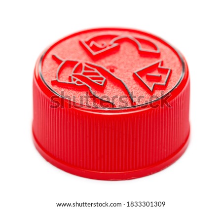 Red plastic bottle cap with instructions isolated on white background