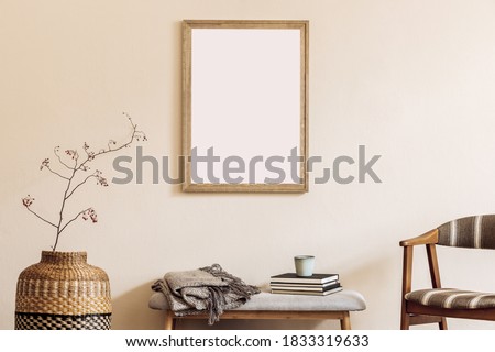 Design scandinavian home interior of living room with mock up poster map, stylish wooden bench, retro chair, rattan basket, flower and elegant accessories. Beige wall. Stylish home staging. Template. 