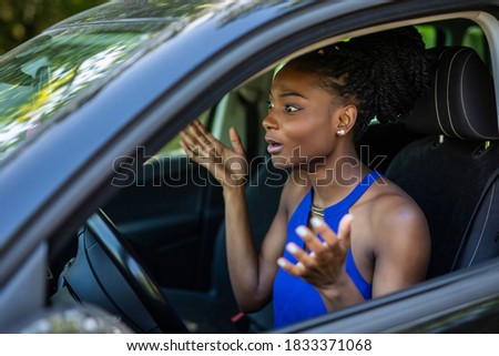 Young african woman driving car on high speed and servived an accident.