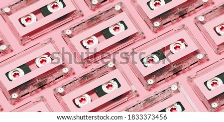 Minimal creative background for retro technology concept. Clear cassette tape with pink label on pink background. 3d rendering illustration. Clipping path of each element included.