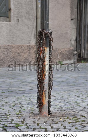 old rusty chain on post
