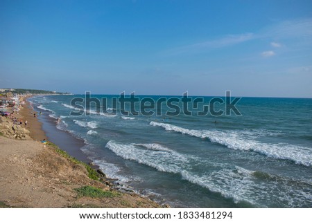 photography of a public beach with waves