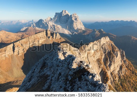 Seasonal autumnal scenery in highlands. Alpine landscape in Dolomite mountains, Southern Tyrol area, Italy. Popular travel destination in autumn.
Aerial autumn sunrise scenery with yellow trees.