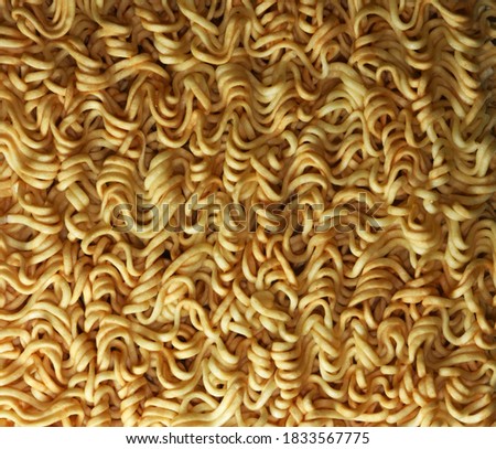 Full frame yellow Instant noodles for background.