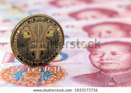 e-RMB gold coin, over 100 yuan banknotes, conceptual image of the digital version of the yuan. Chinese decentralized currency