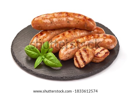Grilled german bratwurst sausages, isolated on white background. Royalty-Free Stock Photo #1833612574