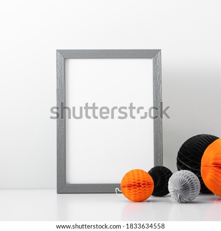 Halloween holiday concept. Photo frame, halloween decorations on white background. Front view, copy space