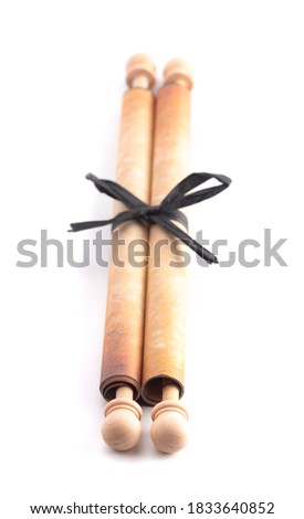 A Rolled Antique Scroll Isolated on a White Background