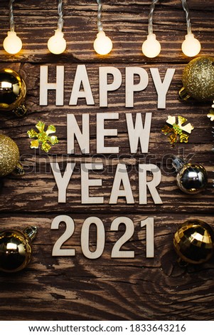 Happy New Year 2021. Symbol from number 2021 on wooden background