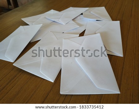 Small white envelopes scattered about