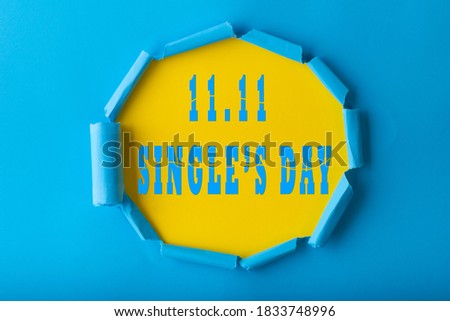 11.11 Single day sale. Blue circle torn paper with 11.11 Single days sale on Yellow color background