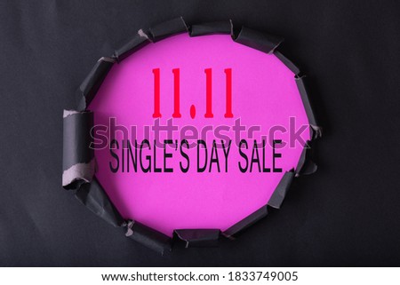 11.11 Single day sale. Black circle torn paper with 11.11 Single days sale on pink color background