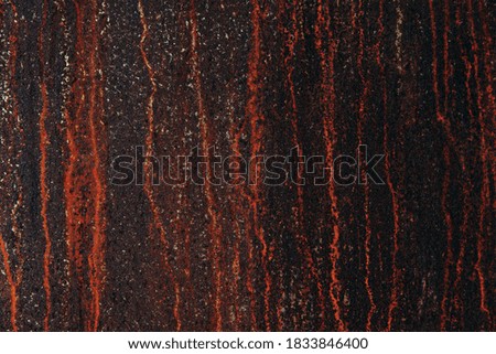 Old metal surface of iron with rusty and dark orange background.