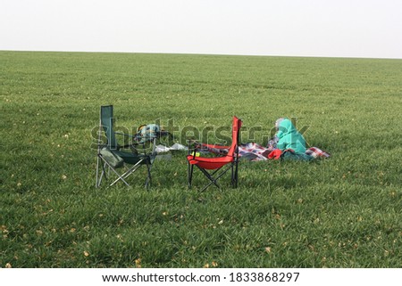 Two children are playing at the campsite. Lawn in autumn