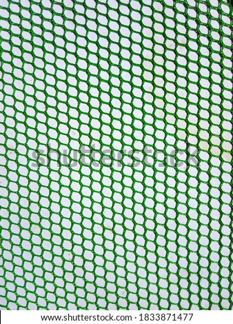 Wicker that is patterned or a cool pattern in green