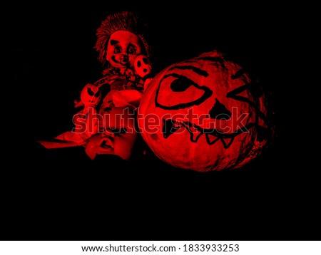 halloween scary pumpkin gang with ghosts and a scary clown and half a broken doll face under red and black lighting