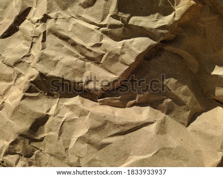old crumpled brown paper texture closeup photo