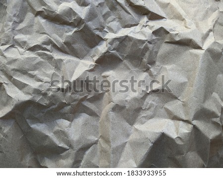 old crumpled gray paper texture closeup photo
