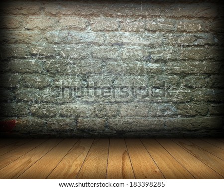 distressed room interior backdrop with old weathered brick wall and spruce wooden tiles on the floor