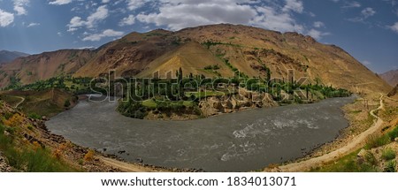 Central Asia. Tajikistan. View from the right Bank of the border river Panj to the left Bank belonging to Afghanistan.