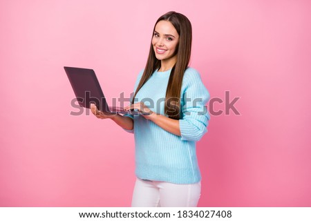 Profile photo of pretty business lady hold notebook browsing website chatting friends social network wear knitted blue sweater white pants isolated pastel pink color background