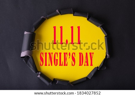 11.11 Single day sale. Black circle torn paper with 11.11 Single days sale on YELLOW color background