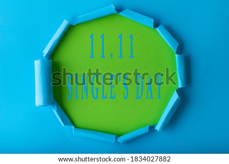 11.11 Single day sale. Blue circle torn paper with 11.11 Single days sale on green color background